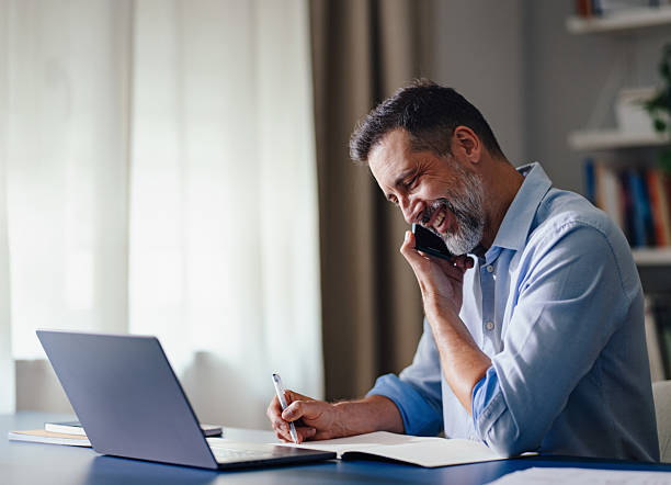 istock Businessman Engaged in a Call While Working at Comfortable Home Office Desk 2230546985