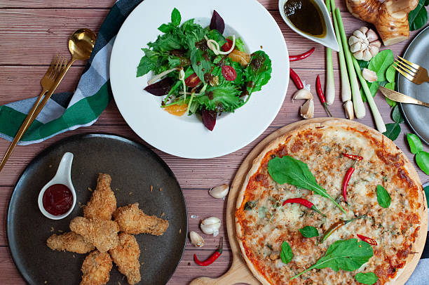 istock Sharing set meals Pizza Salad and Fried chicken legs 2230551870