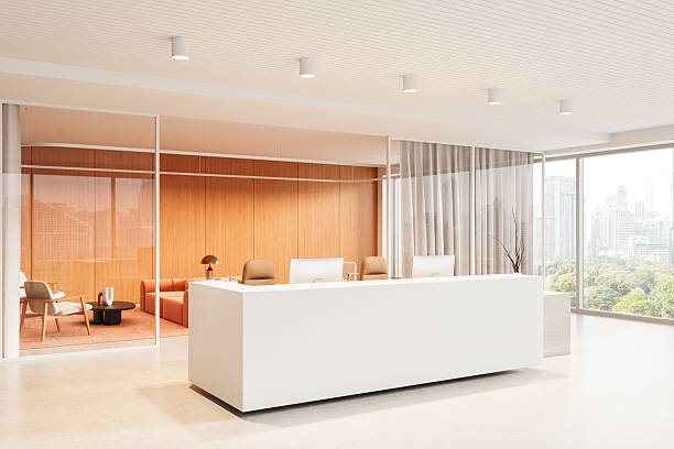 istock Modern office reception interior with white desk, wood panel wall, glass partition, and city view in minimalist concept design. 3D Rendering 2230552620
