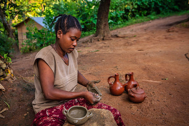 istock Young Ethiopian woman making pottery 2230553074