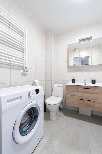 istock Modern Home Bathroom Interior with Washing Machine and Minimalistic Design 2230558038