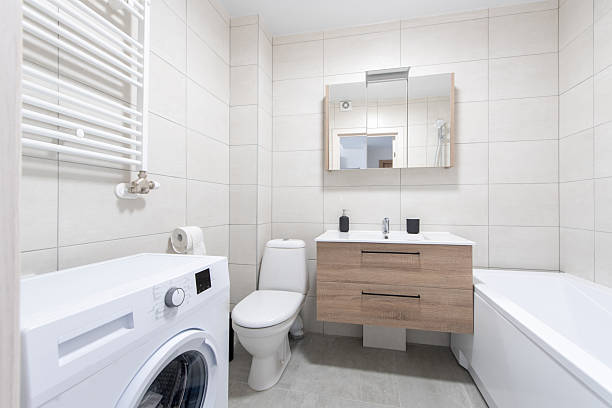 istock Modern Home Bathroom Interior with Washing Machine and Minimalistic Design 2230558084