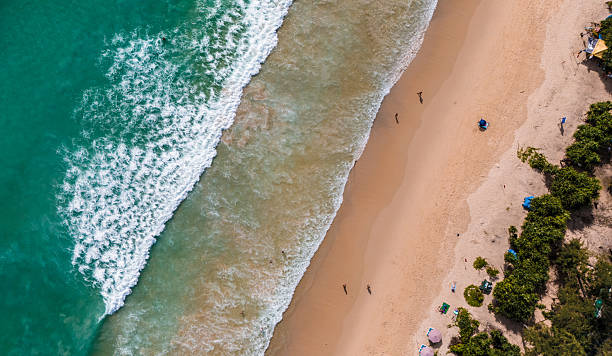 istock Top view beach with waves crashing on sandy shore 2230558343