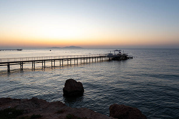 istock Dawn over the sea. The pontoon. Pier. 2230569919