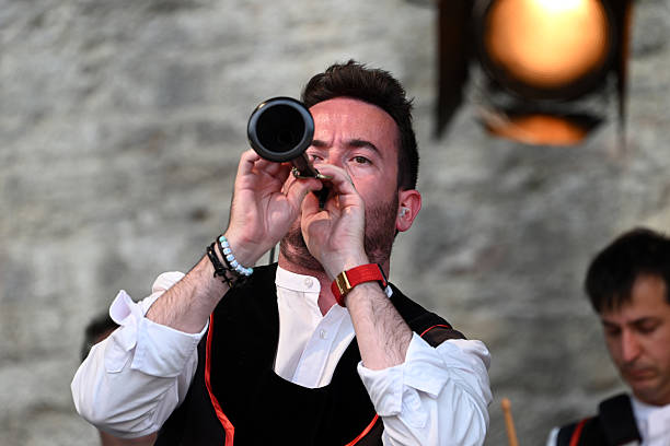 Vannes, France, august 15, 2025 : Man of HIZIV Bagad Hennebont playing bombarde during the Arvor festival in Vannes