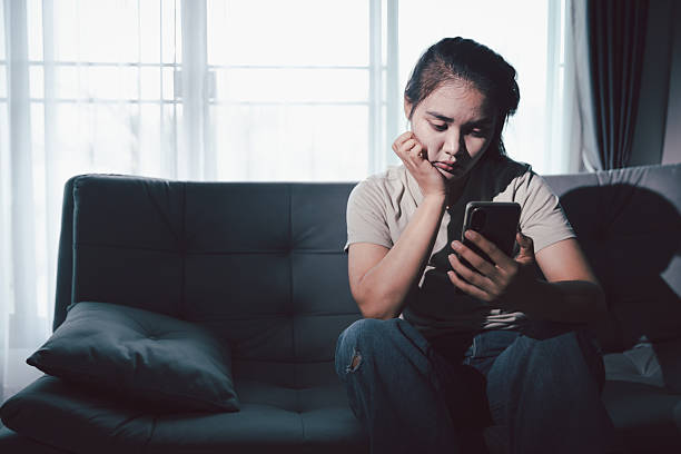 istock Sorrowful woman sat alone, overwhelmed by emotion, her sad and unhappy expression revealing deep despair, stress and distress left feeling depressed. sorrowful sad, despair alone, depressed stress 2230570395