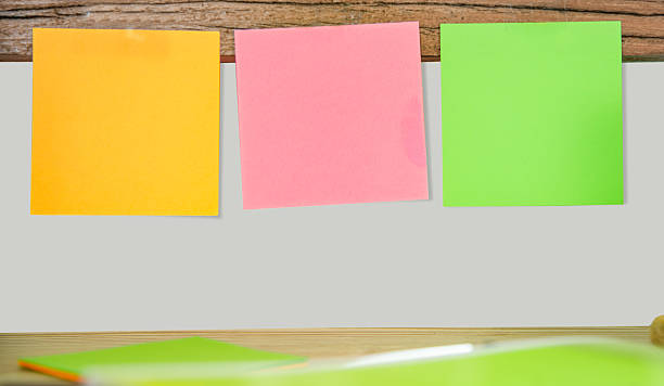 istock Colorful Sticky Notes on Wooden Background 2230576844
