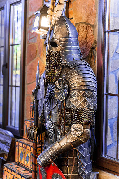 istock A knight in full armor stands in front of a window 2230576846