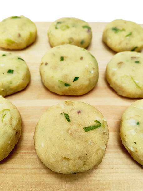 istock Rows of Raw Potato Fritters Patties 2230577666