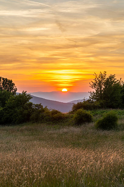 istock Vibrant sunset illuminating mountain range in Slovakia 2230585124