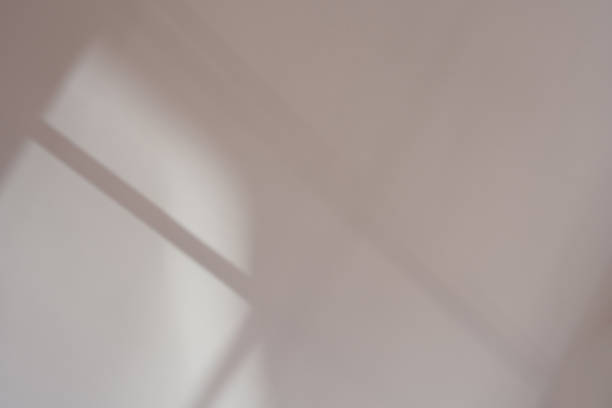 istock Blurry shadow, window light on beige wall,Autumn background brown paint with soft focus for product design,Sale and promotion banner 2230586582