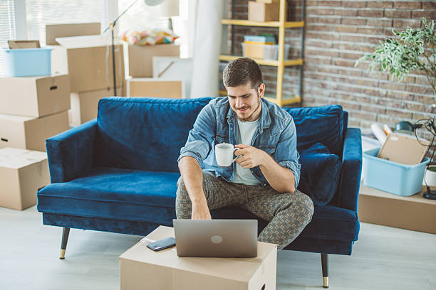 istock Young man just moved in new apartment 2230589933