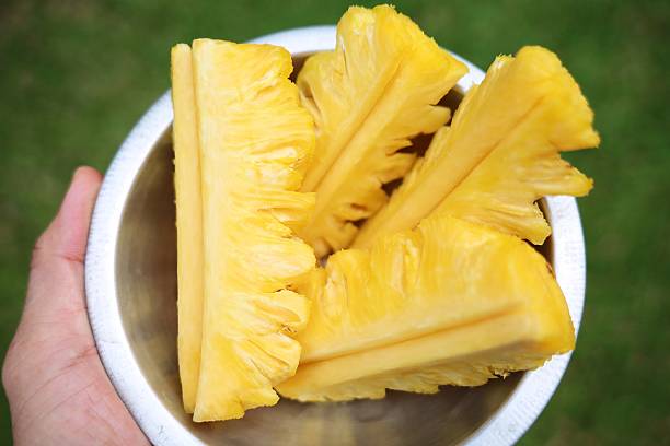 Slices of Pineapple in bowl.