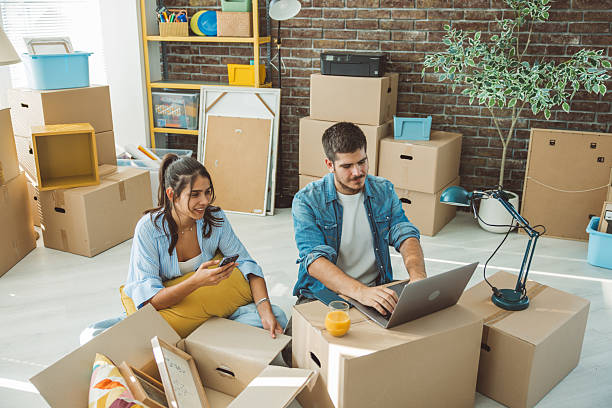 istock Friends just moved in new apartment 2230590651