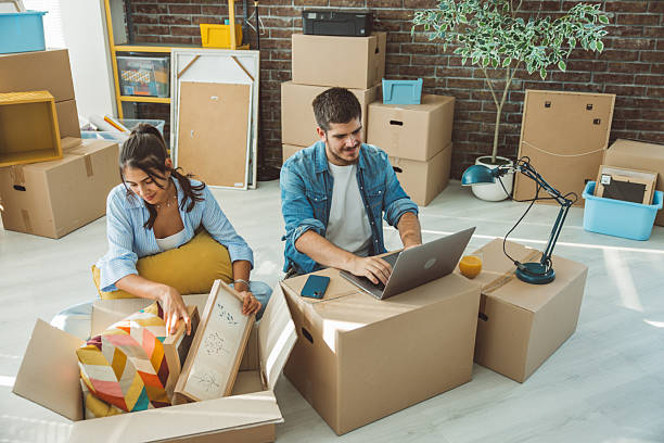 istock Friends just moved in new apartment 2230590701