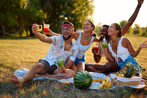 istock Friends taking a selfie while enjoying picnic at sunset 2230591413