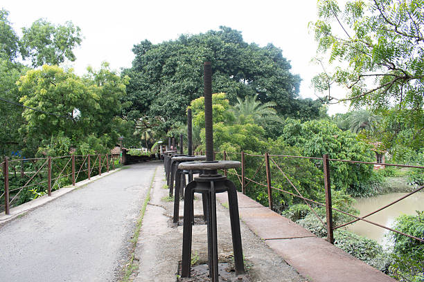old sluice gate bridge with iron mechanisms in geonkhali, west bengal, india