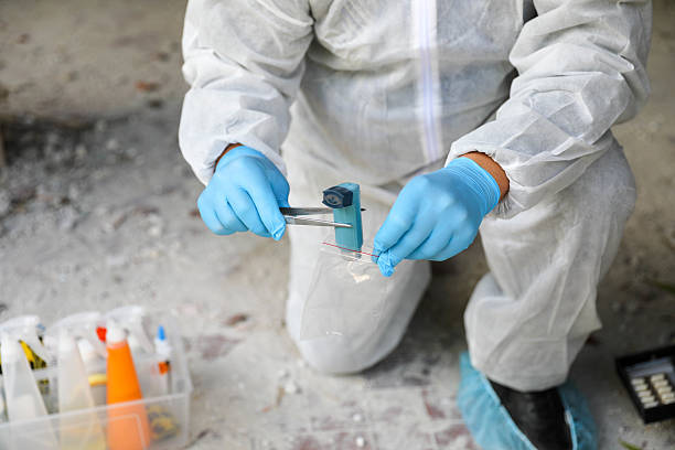 istock Crime Scene Specialist In Full Protective Equipment Indoors 2230601529