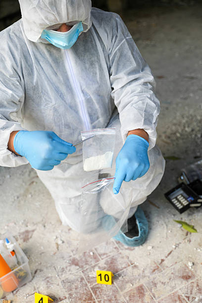 istock Forensic Investigator In Safety Gear Conducting Indoor Analysis 2230601709