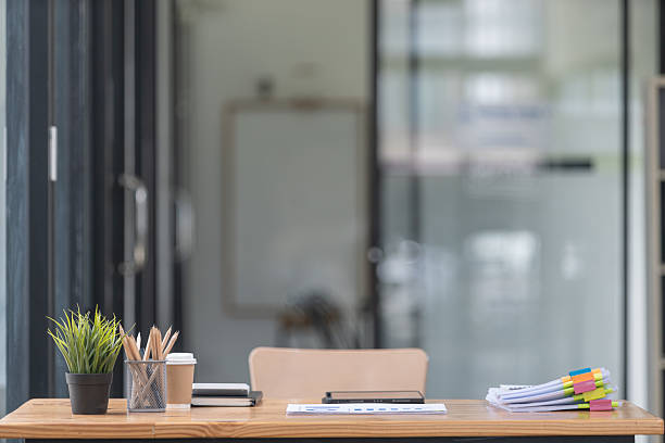 istock A desk with a place for documents, graphs, tablets, and stationery. 2230604107