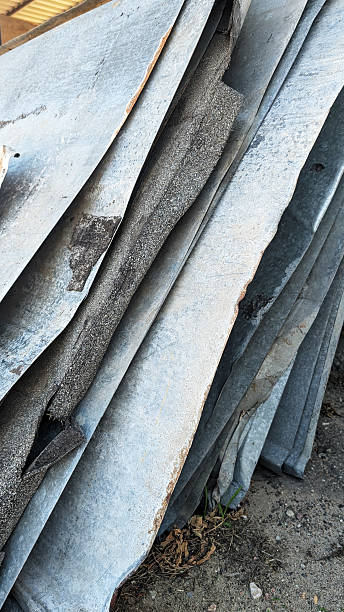 istock Stacked metal sheets with weathered textures and rust, showcasing industrial materials in a construction site environment, emphasizing raw materials and their potential uses 2230607154