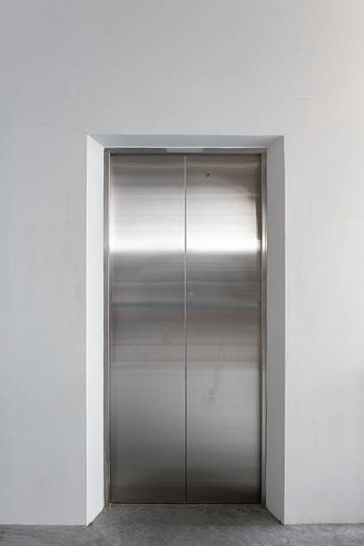 istock Elevator door and concrete floor in high rise building. 2230608817