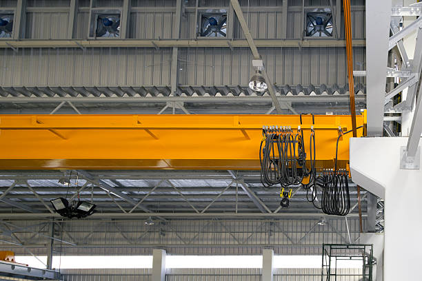 istock Overhead crane or lifting equipment inside factory or warehouse. 2230609189