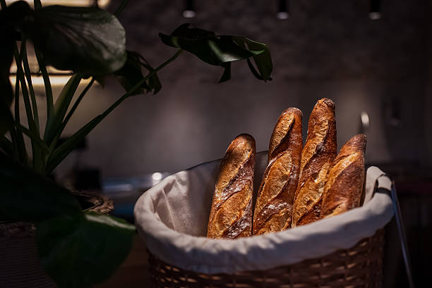 Freshly baked baguettes in a cozy bakery setting after the evening rush