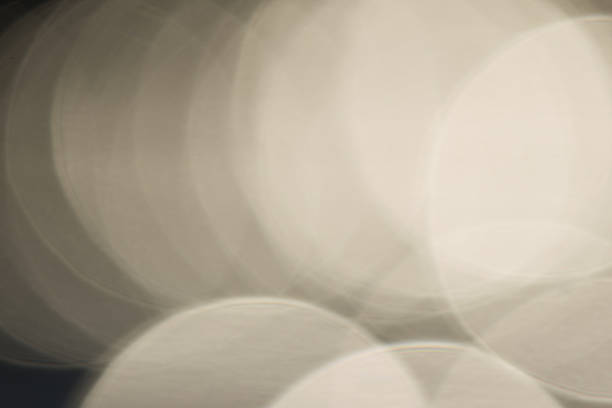 Bokeh, light balls, abstract background, blurred background with bokeh, beige background, golden background