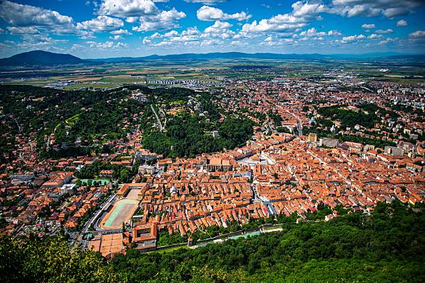 istock Historic Brasov with red roofs and mountains 2230613978