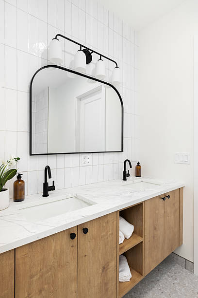 istock A bathroom with a white oak cabinet and white subway tile backsplash. 2230614801