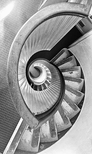 istock Spiral staircase black and white 2230616917