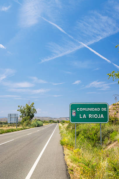 istock Road entering La Rioja Comunidad with blue sky in background 2230620795