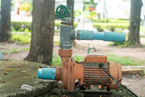 istock Water Pump with Green Valve and Pipes 2230622161