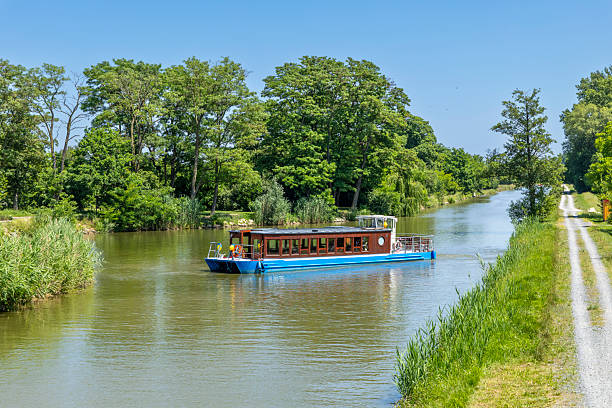 istock Passenger Ferry Navigating Bata Canal in Vnorovy, Czechia, on Sunny Summer Day 2230624006