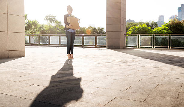 Unemployed woman leaving office building