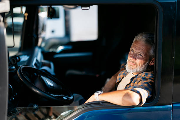 istock Truck driver relaxing in his truck during break 2230629794