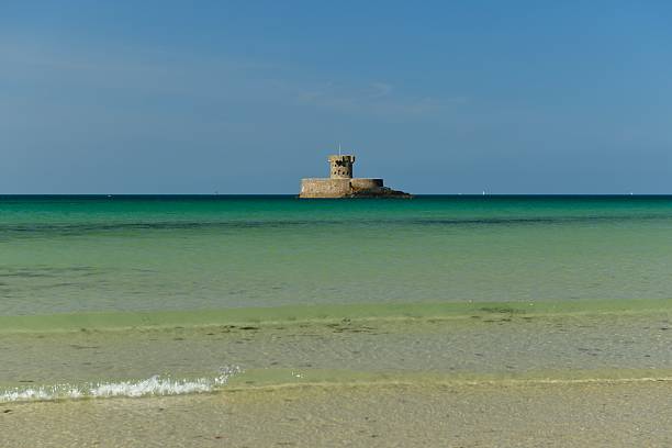 19th century Rocco tower surrounded by a rising tide in the Summer