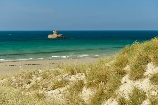 Beautiful Summer coastline with 19th century Rocco tower.