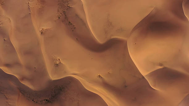 istock Aerial top view on sand dunes in desert 2230642338