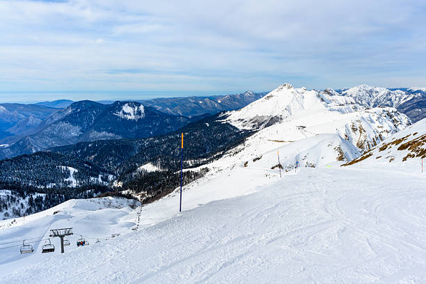 istock A beautifully snowy mountain featuring a ski lift ascending its peak 2230644428