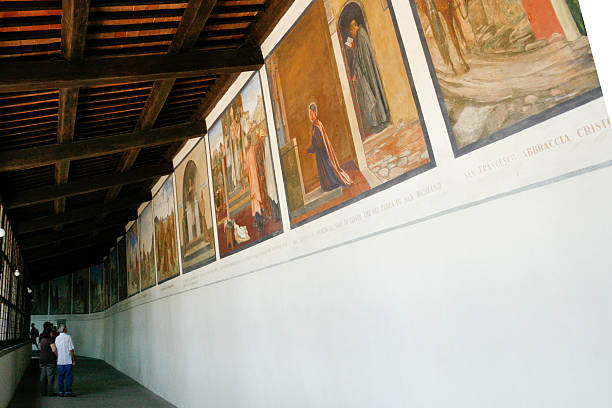 La Verna, Arezzo, Tuscany, Italy - August 22, 2008: view of the corridor connecting the basilica with the chapel of the holy stigmata. On the right side, frescoes depicting the life of St Francis.