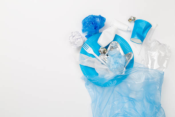 istock Bag with unsorted waste on color background, top view 2230649851