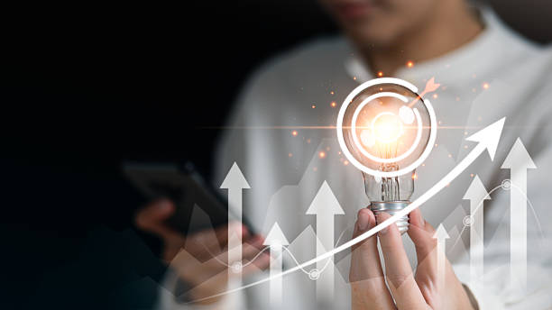 istock Business innovation and growth concept with glowing light bulb, target icon, and upward arrows, symbolizing creativity, strategic vision, and successful achievement in modern industry. 2230657319