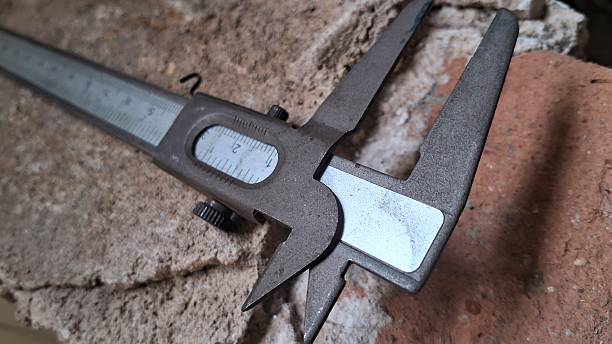 istock Close-up of a Vernier Caliper Measuring a Brick 2230657642