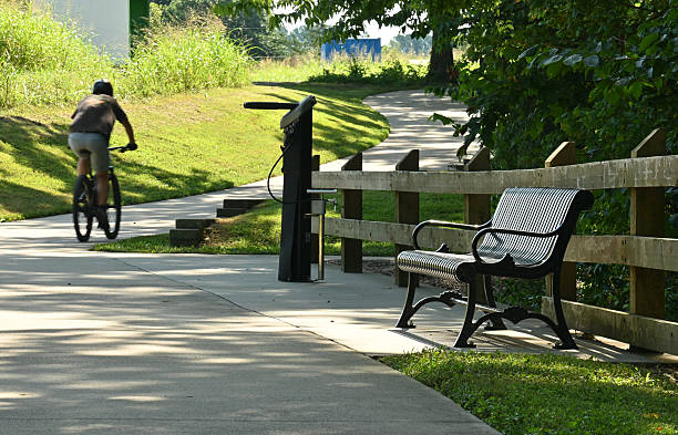 istock Walking trail with bench, cyclist 2230663481