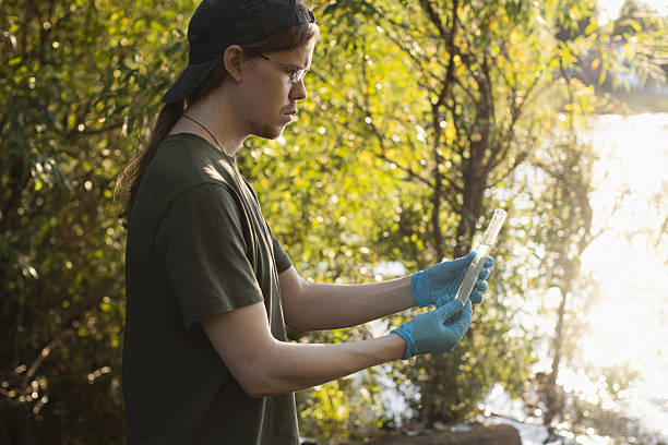 istock Scientist takes water samples into test tube 2230664466