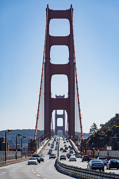 View of the Golden Gate Bridge on a sunny day, showing vehicles crossing the iconic suspension bridge in San Francisco, California