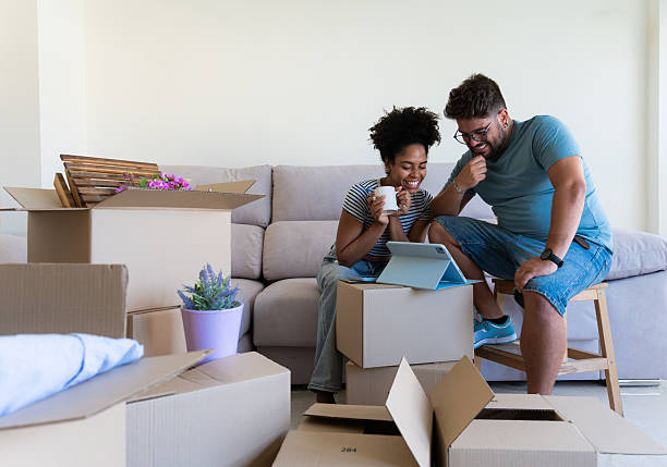 istock Happy couple planning new home decor using digital tablet 2230667145