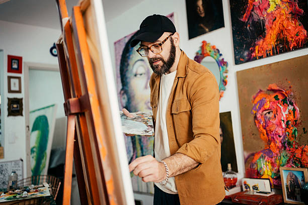 istock Artist painting in his studio 2230675306